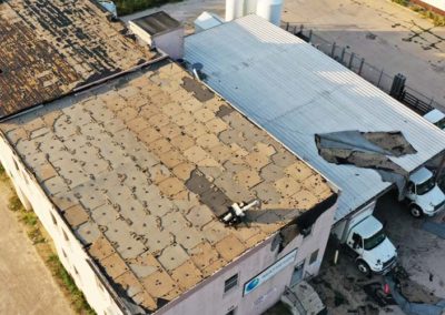 Flat Roof Membrane Torn Off From Wind
