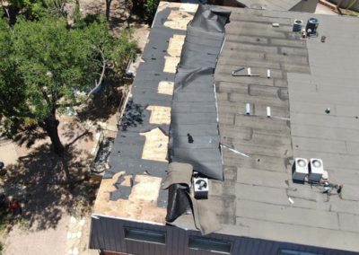 Roof Membrane Folded Over by Wind