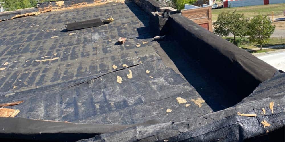 Flat Roof Membrane Ripped by Wind